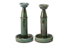 A PAIR OF CHINESE GREEN GLAZED TALL CANDLESTICKS