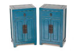 A PAIR OF BLUE PAINTED BEDSIDE CABINETS