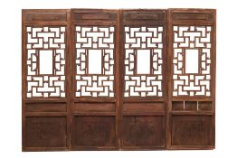 A SET OF FOUR CHINESE CARVED SCREEN PANELS