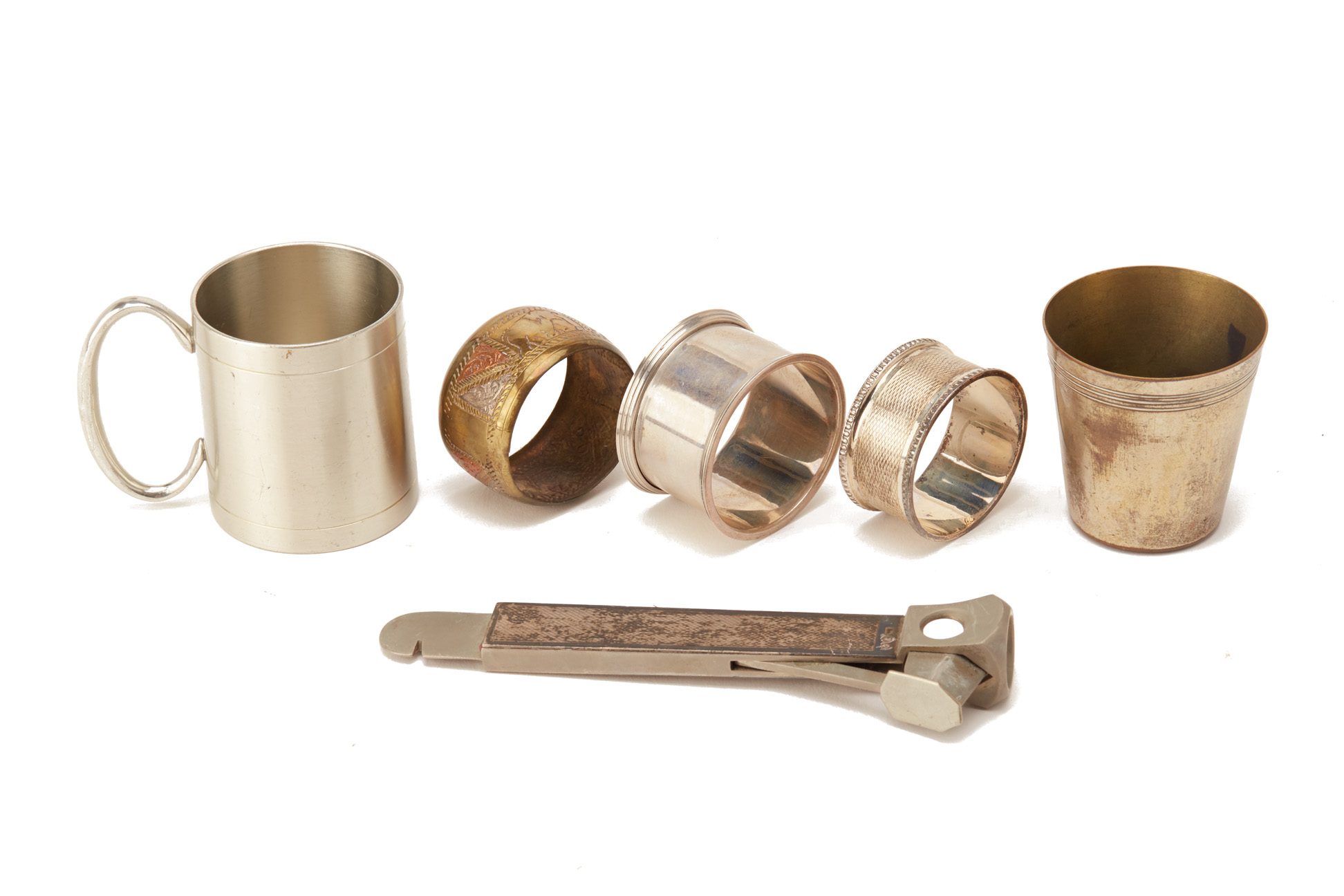 A SILVER MOUNTED CIGAR CUTTER AND NAPKIN RING