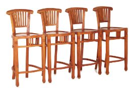 A SET OF FOUR WOODEN BAR STOOLS