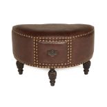 A LEATHER UPHOLSTERED STOOL