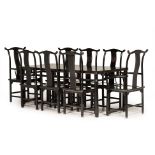 A CHINESE BLACK LACQUER DINING TABLE AND CHAIRS