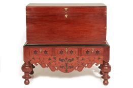 AN INDO DUTCH MAHOGANY TRUNK ON STAND