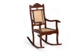 AN ANGLO INDIAN TEAK ROCKING CHAIR