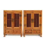 A PAIR OF CHINESE ELM BEDSIDE CABINETS