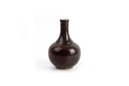 A CHINESE FLAMBE / BROWN GLAZED BOTTLE VASE