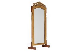 A CARVED WOOD MIRROR ON STAND