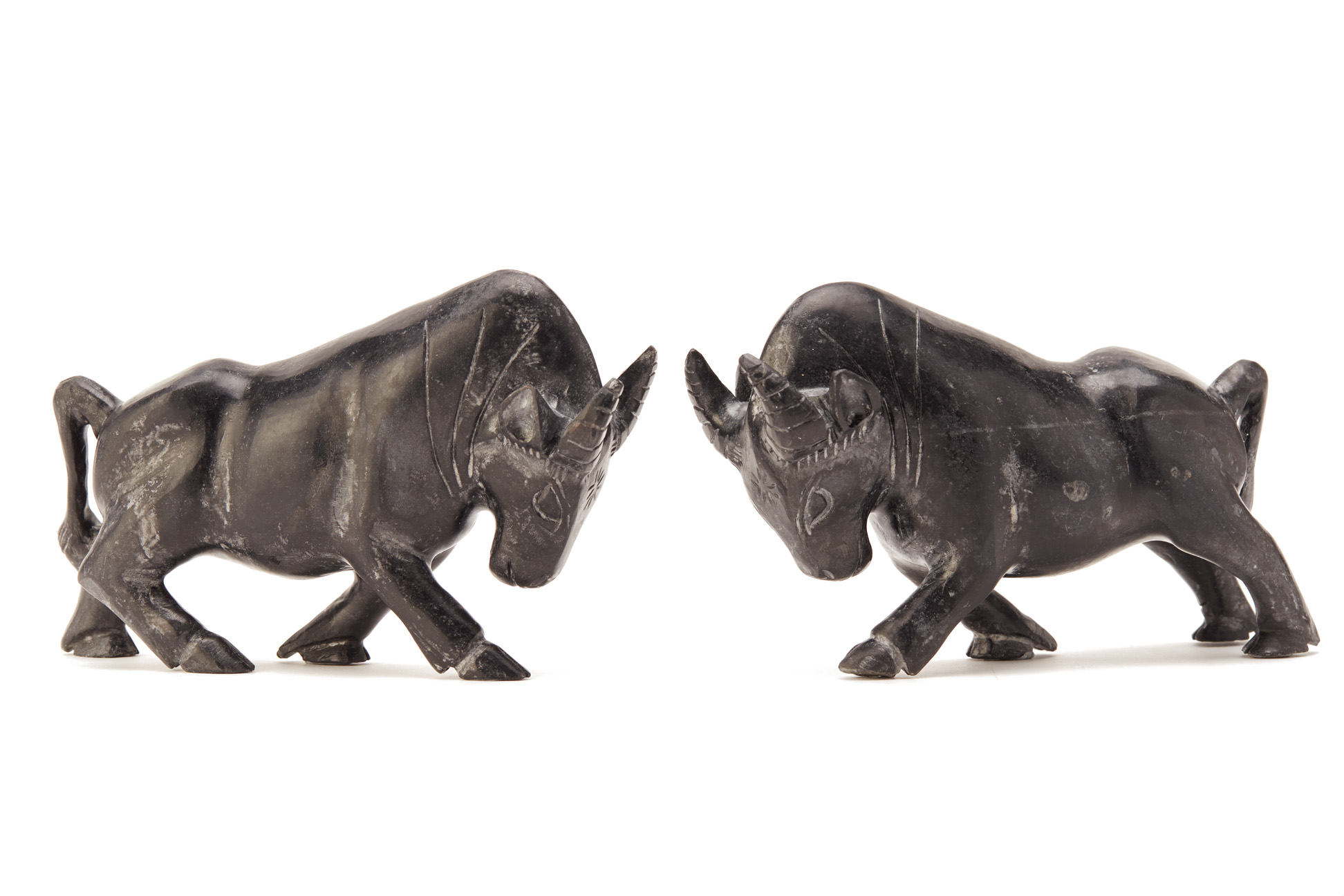 A PAIR OF CHINESE CARVED STONE MODELS OF BULLS