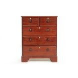 A MAHOGANY CHEST OF DRAWERS