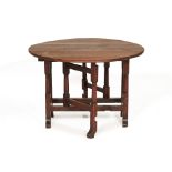 AN ANTIQUE OAK GATELEG TABLE