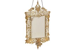 A VICTORIAN CAST AND PIERCED BRASS GIRANDOLE WALL MIRROR