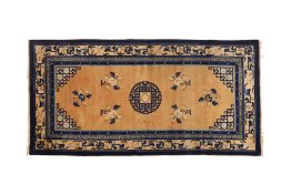 A CHINESE BLUE AND CREAM GROUND RUG