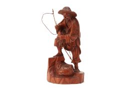 A JAPANESE CARVED WOODEN FIGURE OF A FISHERMAN