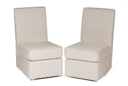 A PAIR OF LOW CHAIRS