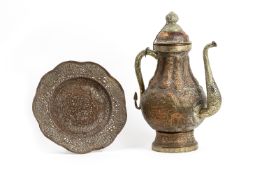 A COPPER AND BRASS EWER AND PLATE