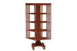 A MAHOGANY REVOLVING BOOKCASE