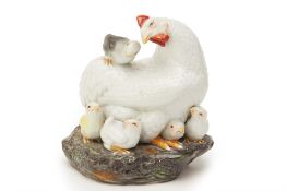 A CHINESE PORCELAIN MODEL OF A HEN WITH CHICKS