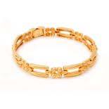 A GOLD GATE LINK BRACELET