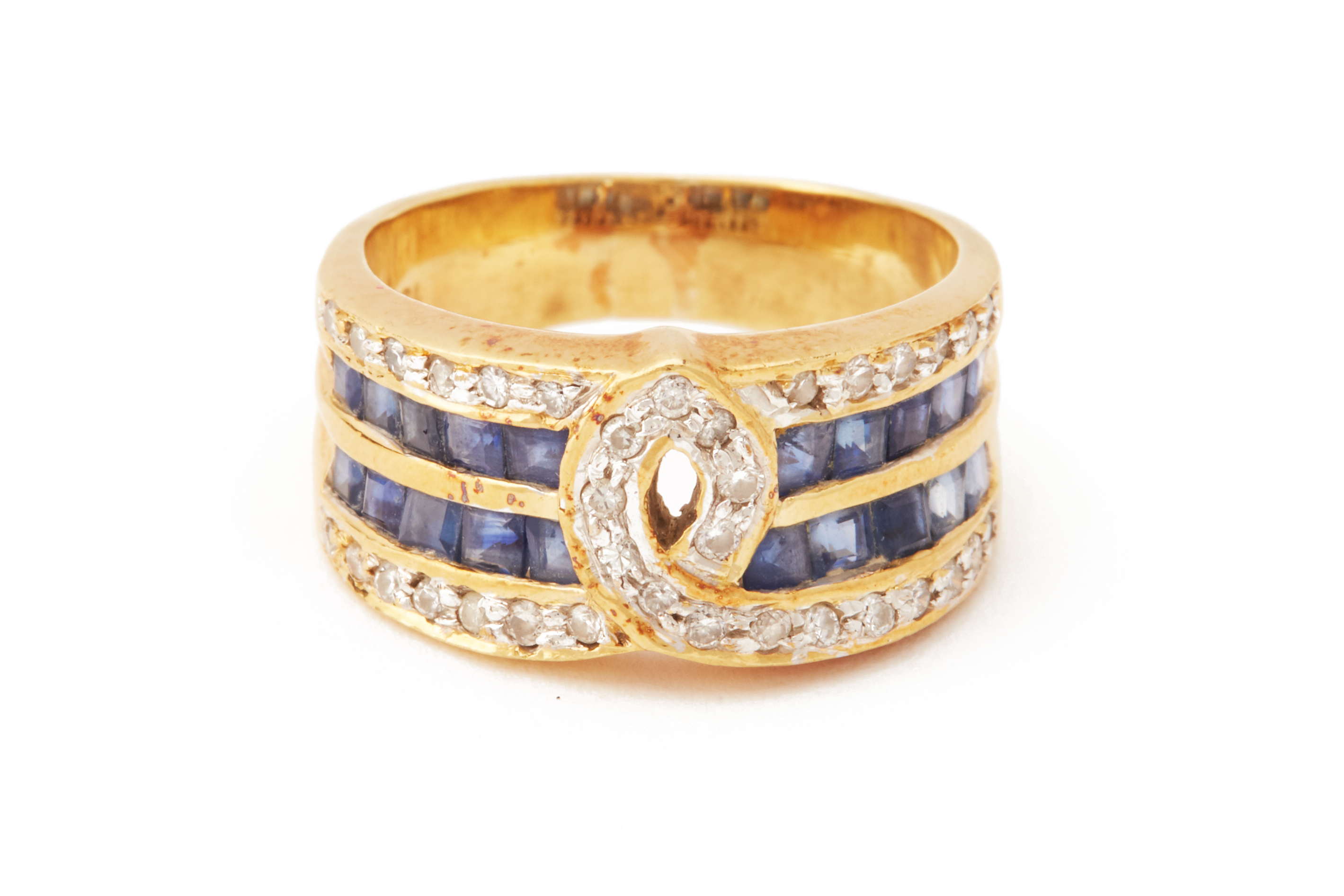 A SAPPHIRE AND DIAMOND BAND RING