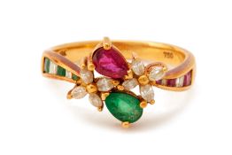 A DIAMOND, EMERALD & RUBY FLORAL RING