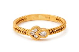 A GOLD AND DIAMOND RING