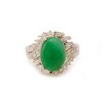 A WHITE GOLD DIAMOND AND CABOCHON JADE RING