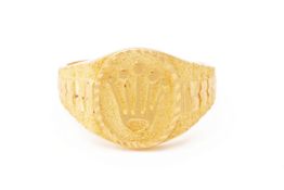 A GOLD SIGNET RING WITH ROLEX CROWN LOGO