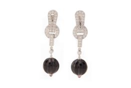 A PAIR OF CARTIER DIAMOND, ONYX AND RUBY 'AGRAFE' EARRINGS