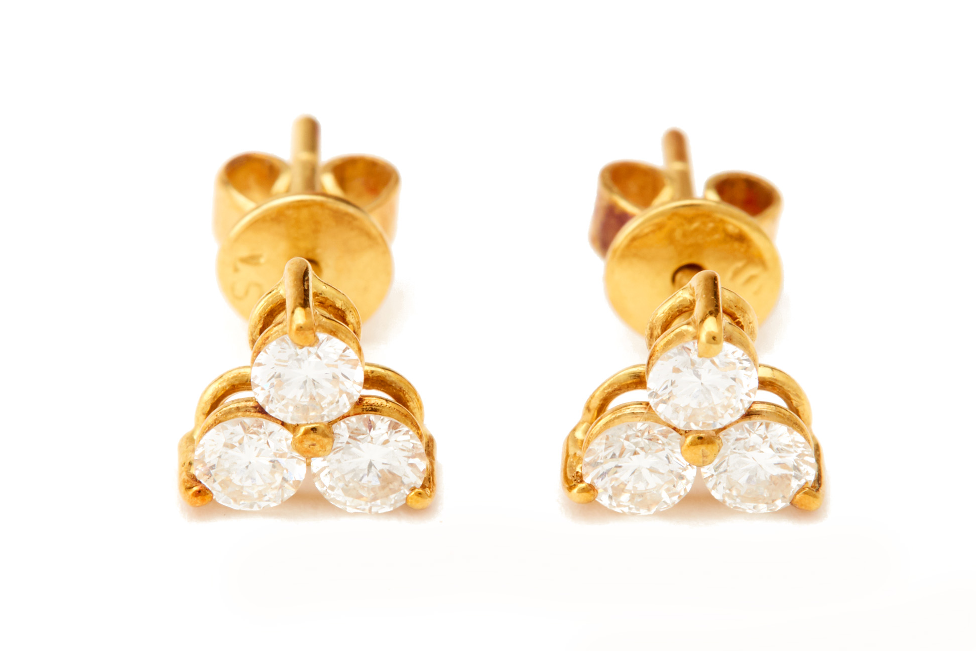 A PAIR OF THREE STONE DIAMOND EAR STUDS