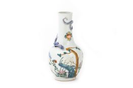 A FAMILLE ROSE RELIEF DECORATED DRAGON VASE