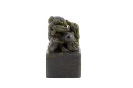 A CARVED JADE BUDDHIST LION SEAL