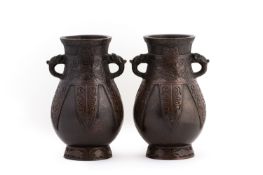 A PAIR OF CHINESE BRONZE TWIN HANDLED VASES
