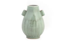 A CELADON TWIN HANDLED VASE