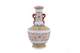 A TWIN HANDLED AND ENAMELLED PORCELAIN VASE