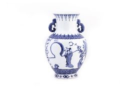 A TWIN HANDLED BLUE AND WHITE BALUSTER PORCELAIN VASE