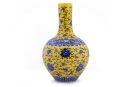 A CHINESE YELLOW GROUND BLUE AND WHITE 'TIANQIUPING' VASE