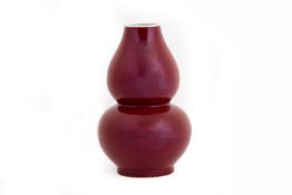 A SANG DE BOEUF DOUBLE GOURD PORCELAIN VASE