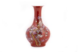 A LARGE RED GROUND PORCELAIN VASE