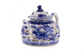 AN OVERSIZED PORCELAIN TEAPOT