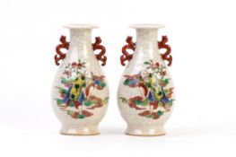 A PAIR OF CRACKLE GLAZED TWIN HANDLED VASES