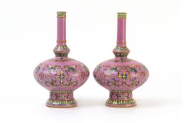 A PAIR OF PINK GROUND SGRAFFITO FAMILLE ROSE VASES