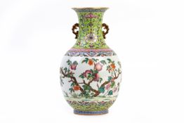 A FAMILLE ROSE TWIN-HANDLED BALUSTER PORCELAIN VASE