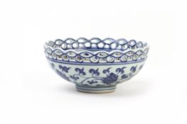 A BLUE AND WHITE PORCELAIN LOTUS BOWL WITH RETICULATED RIM