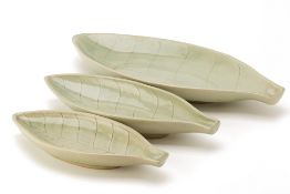 A SET OF THREE CELADON LEAF PRESENTATION DISHES