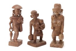 THREE SOUTHEAST ASIAN TRIBAL CARVED WOOD FIGURES