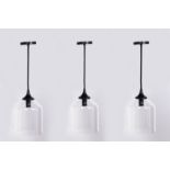 A SET OF THREE CONTEMPORARY PENDANT LIGHTS