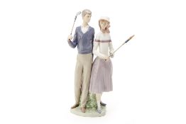 A LLADRO PORCELAIN GOLFING COUPLE