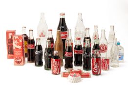 A COLLECTION OF ASSORTED COCA COLA GLASS BOTTLES