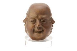 A BRONZE FOUR FACED BUDDHA HEAD